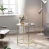 Elegant runt sidobord i guld med glasskiva, 50 cm